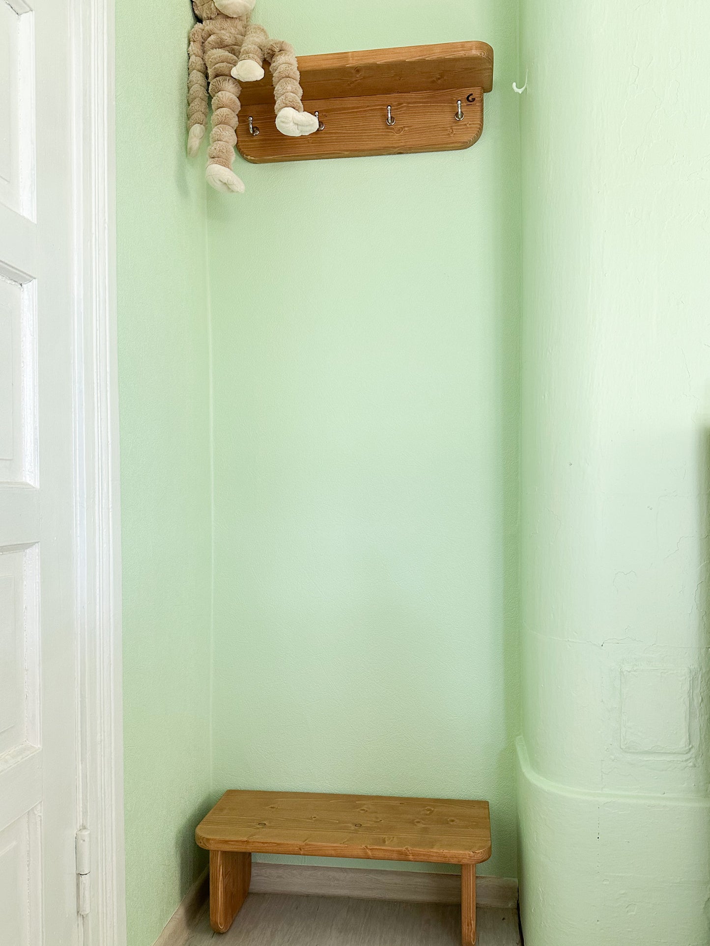 Entryway hanger hooks and small bench for shoes