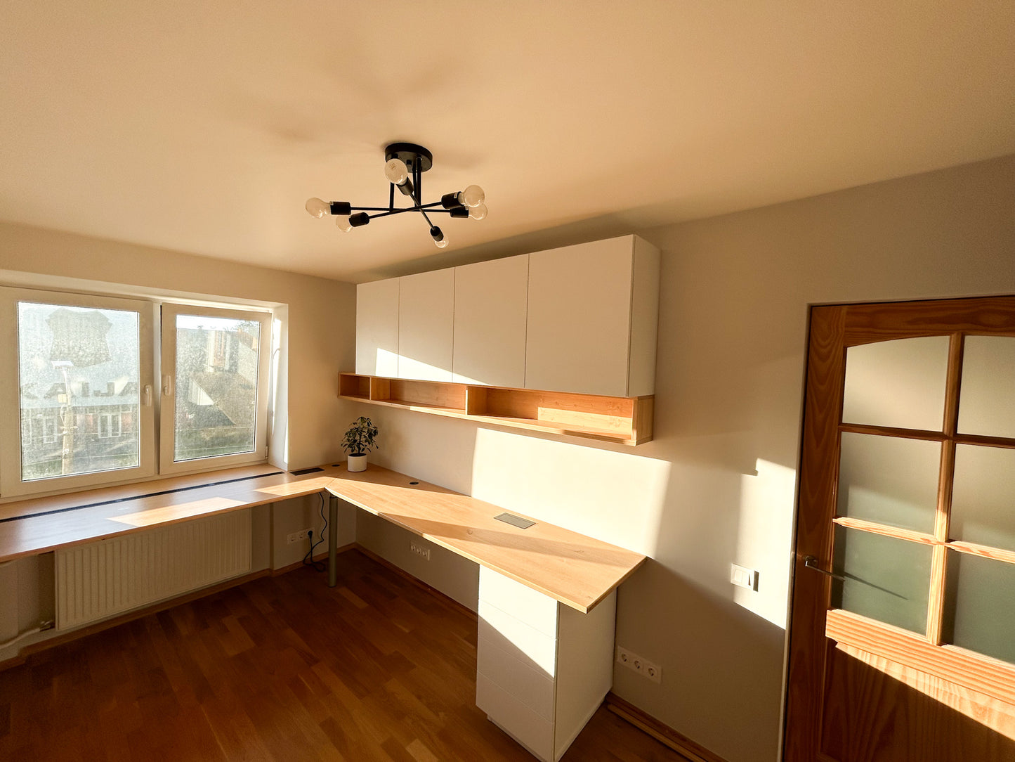 Home office large desks with windowsills, bookcase and display shelves